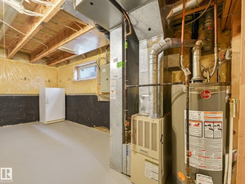 Brand-New Hot Water Tank - 1142 Barnes Way Sw, Edmonton, AB - Indoor Photo Showing Basement