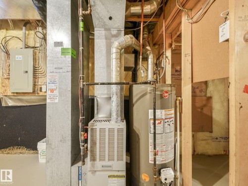 Brand-New Hot Water Tank - 1142 Barnes Way Sw, Edmonton, AB - Indoor Photo Showing Basement