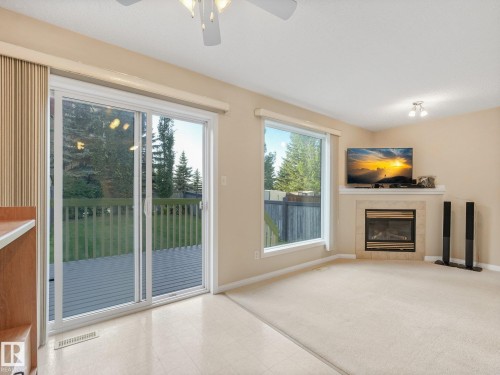 1142 Barnes Way Sw, Edmonton, AB - Indoor Photo Showing Other Room With Fireplace