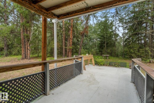 Covered back door deck to the natural hill top forested backyard - 2, 59031 Range Rd 232, Rural Thorhild County, AB - Outdoor With Deck Patio Veranda With Exterior