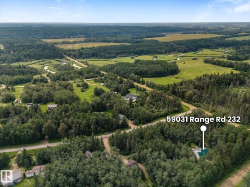 Expansive property featuring dense tree coverage, open fields, and winding waterways - 2, 59031 Range Rd 232, Rural Thorhild County, AB - Outdoor With View