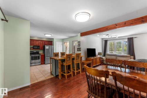 Kitchen with wood cabinetry and stainless steel appliances - 2, 59031 Range Rd 232, Rural Thorhild County, AB - Indoor Photo Showing Dining Room