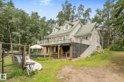 1 1/2 storey with walkout basement ,metal roof,  and a wrap-around deck - 2, 59031 Range Rd 232, Rural Thorhild County, AB - Outdoor With Deck Patio Veranda