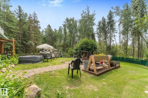 Expansive grassy yard with mature trees - 2, 59031 Range Rd 232, Rural Thorhild County, AB - Outdoor With Backyard