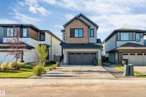 Two-story exterior with multi-toned siding and wood-finish accents - 3236 Chernowski Way Sw, Edmonton, AB - Outdoor With Facade