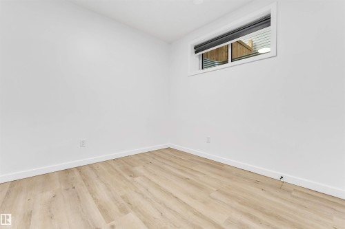 Basement (Room 1) Light wood-finish flooring with white walls - 3236 Chernowski Way Sw, Edmonton, AB - Indoor Photo Showing Other Room
