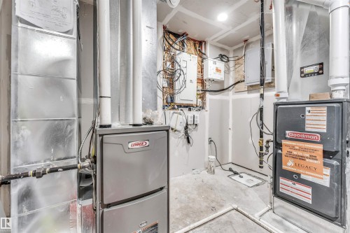 Additional content. 2 Furnaces - 3236 Chernowski Way Sw, Edmonton, AB - Indoor Photo Showing Basement