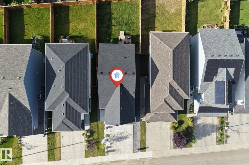 Pitched roofline with dark shingle roofing - 3236 Chernowski Way Sw, Edmonton, AB - Outdoor