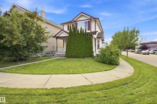 Two-story residence featuring a covered front porch, bay window, and a concrete walkway - 204 84 Street Sw, Edmonton, AB - Outdoor