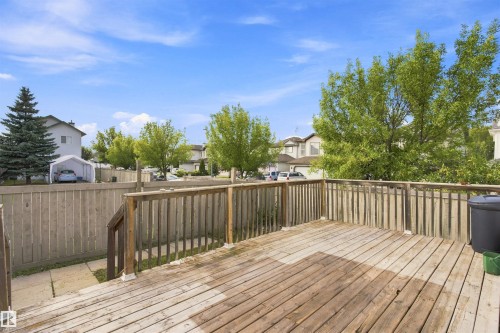 Wood-finish deck with railing and a perimeter fence - 204 84 Street Sw, Edmonton, AB - Outdoor With Deck Patio Veranda With Exterior