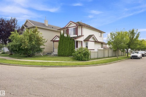 Two-story residence featuring light-colored siding and a contrasting roof - 204 84 Street Sw, Edmonton, AB - Outdoor