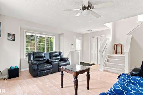 Recessed lighting, wood-finish flooring, and a ceiling fan with integrated lighting - 204 84 Street Sw, Edmonton, AB - Indoor Photo Showing Living Room