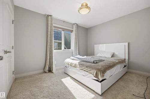 Neutral paint colors with white trim - 2043 Cameron Ravine Way Nw, Edmonton, AB - Indoor Photo Showing Bedroom