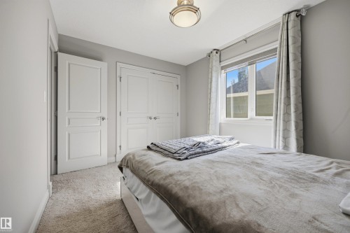 Neutral-toned walls complement the carpeted flooring - 2043 Cameron Ravine Way Nw, Edmonton, AB - Indoor Photo Showing Bedroom