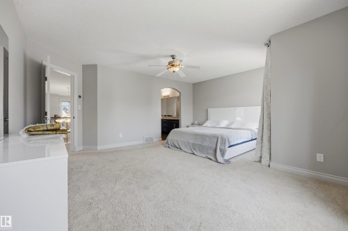 Expansive room with neutral carpeting and light gray wall tones - 2043 Cameron Ravine Way Nw, Edmonton, AB - Indoor Photo Showing Bedroom