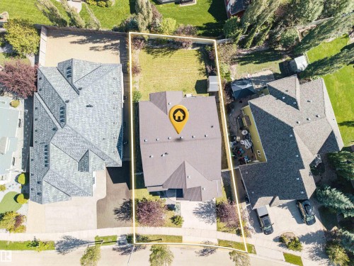 Expansive property with a large, level lot featuring mature trees and a substantial roofline - 2043 Cameron Ravine Way Nw, Edmonton, AB - Outdoor With View