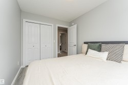 Room featuring light gray walls and wood-finish flooring - 