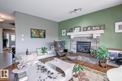 6175 Stinson Way Nw, Edmonton, AB - Indoor Photo Showing Living Room With Fireplace