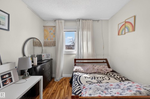 Wood-finish flooring - 9007 169 Avenue Nw, Edmonton, AB - Indoor Photo Showing Bedroom
