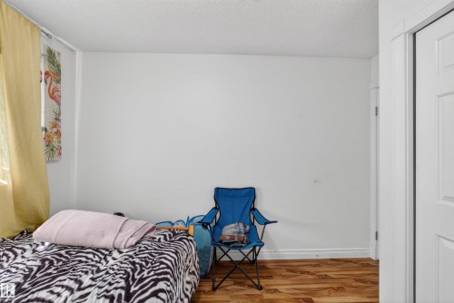 Wood-finish flooring, white walls, and a white ceiling - 9007 169 Avenue Nw, Edmonton, AB - Indoor Photo Showing Bedroom