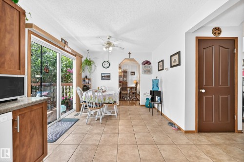 Tile flooring extends through the space - 13069 37 Street Nw, Edmonton, AB - Indoor