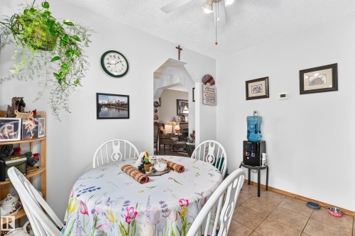 Recessed arched doorway - 13069 37 Street Nw, Edmonton, AB - Indoor Photo Showing Dining Room