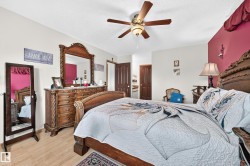 Wood-finish flooring with a ceiling fan light fixture - 