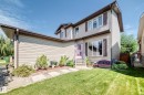 Two-story home with horizontal siding, multiple windows, and a covered front entry - 13069 37 Street Nw, Edmonton, AB  - Outdoor 
