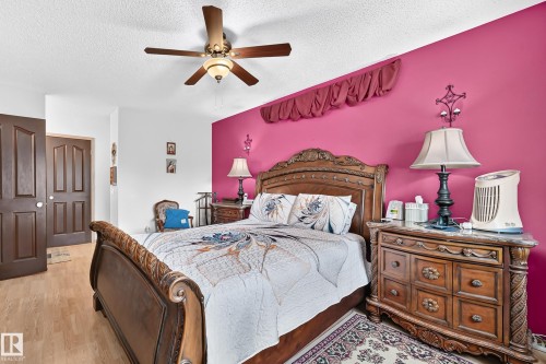Recessed lighting, wood-finish flooring, ceiling fan, and solid panel doors - 13069 37 Street Nw, Edmonton, AB - Indoor Photo Showing Bedroom