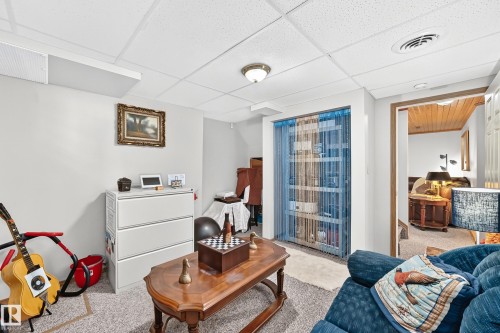 Recessed ceiling light fixture and white ceiling tiles - 13069 37 Street Nw, Edmonton, AB - Indoor