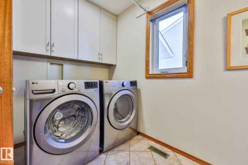 The high-end washer and dryer is less than a year old - 3764 30 Street Nw, Edmonton, AB - Indoor Photo Showing Laundry Room