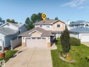 Two-story property featuring light-toned siding, an attached two-car garage, and a concrete driveway - 3764 30 Street Nw, Edmonton, AB  - Outdoor 