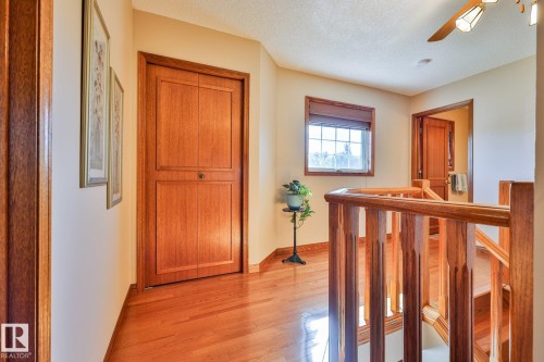Upper level landing boasting oak hardwood floors - 3764 30 Street Nw, Edmonton, AB - Indoor Photo Showing Other Room