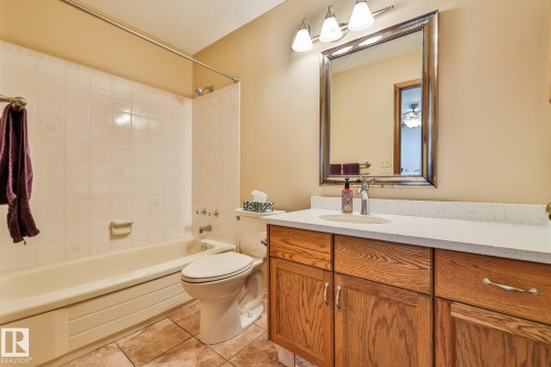 The upgraded 4-pce ensuite features quartz counter tops and porcelain tile flooring - 3764 30 Street Nw, Edmonton, AB - Indoor Photo Showing Bathroom