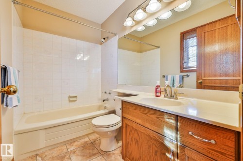 The second 4-pce upper level bath boasts porcelain tile flooring - 3764 30 Street Nw, Edmonton, AB - Indoor Photo Showing Bathroom