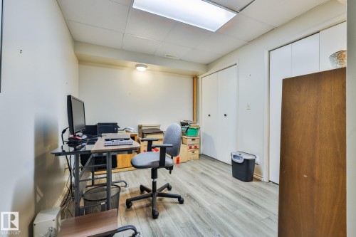 The lower level office boasts newer plank vinyl flooring - 3764 30 Street Nw, Edmonton, AB - Indoor Photo Showing Office
