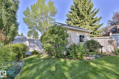 Manicured lawn, mature trees, garden shed, privacy fencing, established landscaping - 3764 30 Street Nw, Edmonton, AB - Outdoor