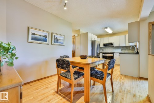 Open-concept dining area with birch hardwood flooring - 3764 30 Street Nw, Edmonton, AB - Indoor Photo Showing Dining Room