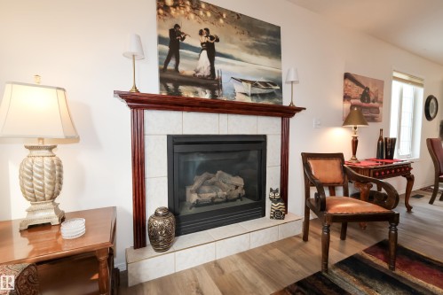 9826 100A Avenue, Morinville, AB - Indoor Photo Showing Living Room With Fireplace