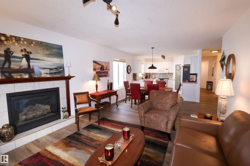 9826 100A Avenue, Morinville, AB - Indoor Photo Showing Living Room With Fireplace