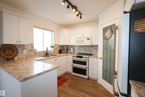 9826 100A Avenue, Morinville, AB - Indoor Photo Showing Kitchen With Double Sink