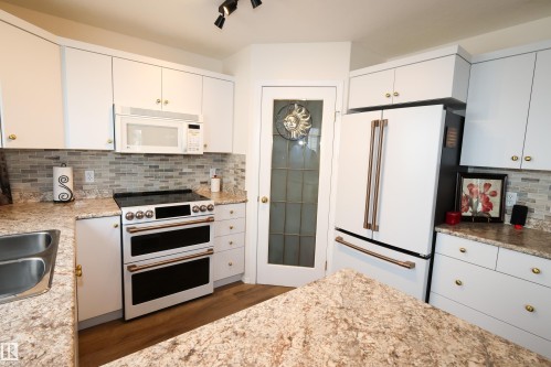 9826 100A Avenue, Morinville, AB - Indoor Photo Showing Kitchen With Double Sink