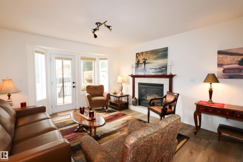 9826 100A Avenue, Morinville, AB - Indoor Photo Showing Living Room With Fireplace