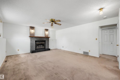 4 Blue Quill Crescent Nw, Edmonton, AB - Indoor Photo Showing Living Room With Fireplace