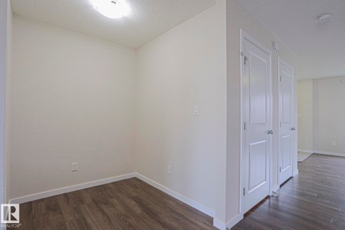 Wood-finish flooring - 308 Watt Boulevard Sw, Edmonton, AB - Indoor Photo Showing Other Room