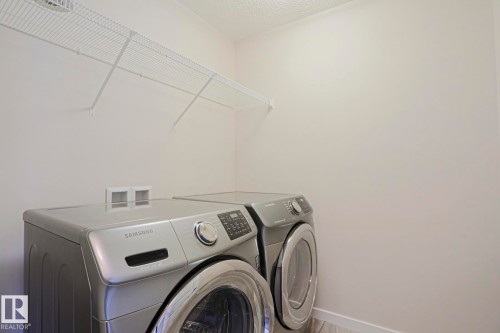 Laundry area featuring a wire storage shelf - 308 Watt Boulevard Sw, Edmonton, AB - Indoor Photo Showing Laundry Room
