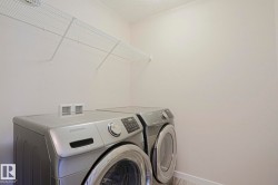 Laundry area featuring a wire storage shelf - 