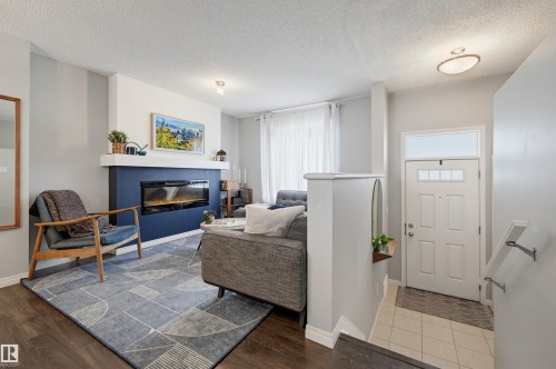 #126 2905 141 St Sw, Edmonton, AB - Indoor Photo Showing Living Room With Fireplace