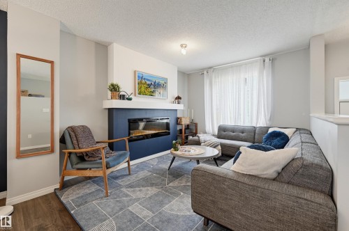 #126 2905 141 St Sw, Edmonton, AB - Indoor Photo Showing Living Room With Fireplace