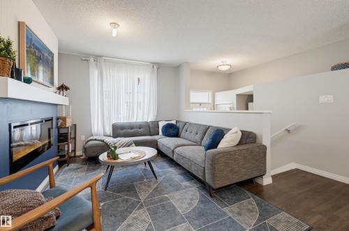 #126 2905 141 St Sw, Edmonton, AB - Indoor Photo Showing Living Room With Fireplace